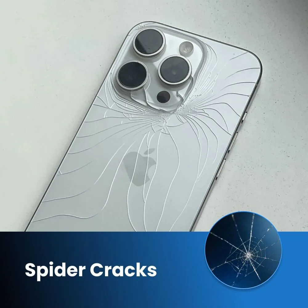 Phone lying face down with a spider crack across its glass back panel